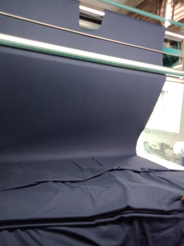 Navy fabric across the spreading table